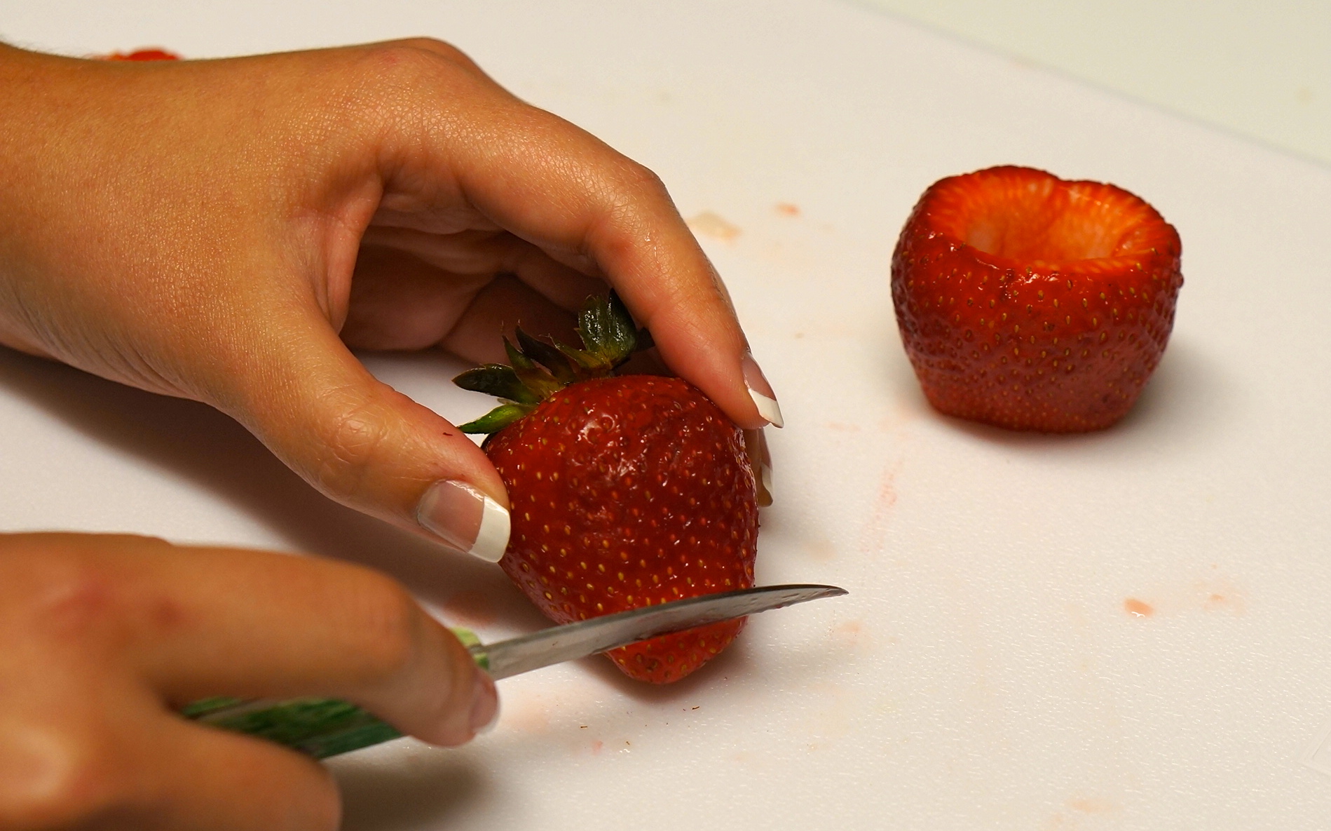 making-shots-in-strawberries